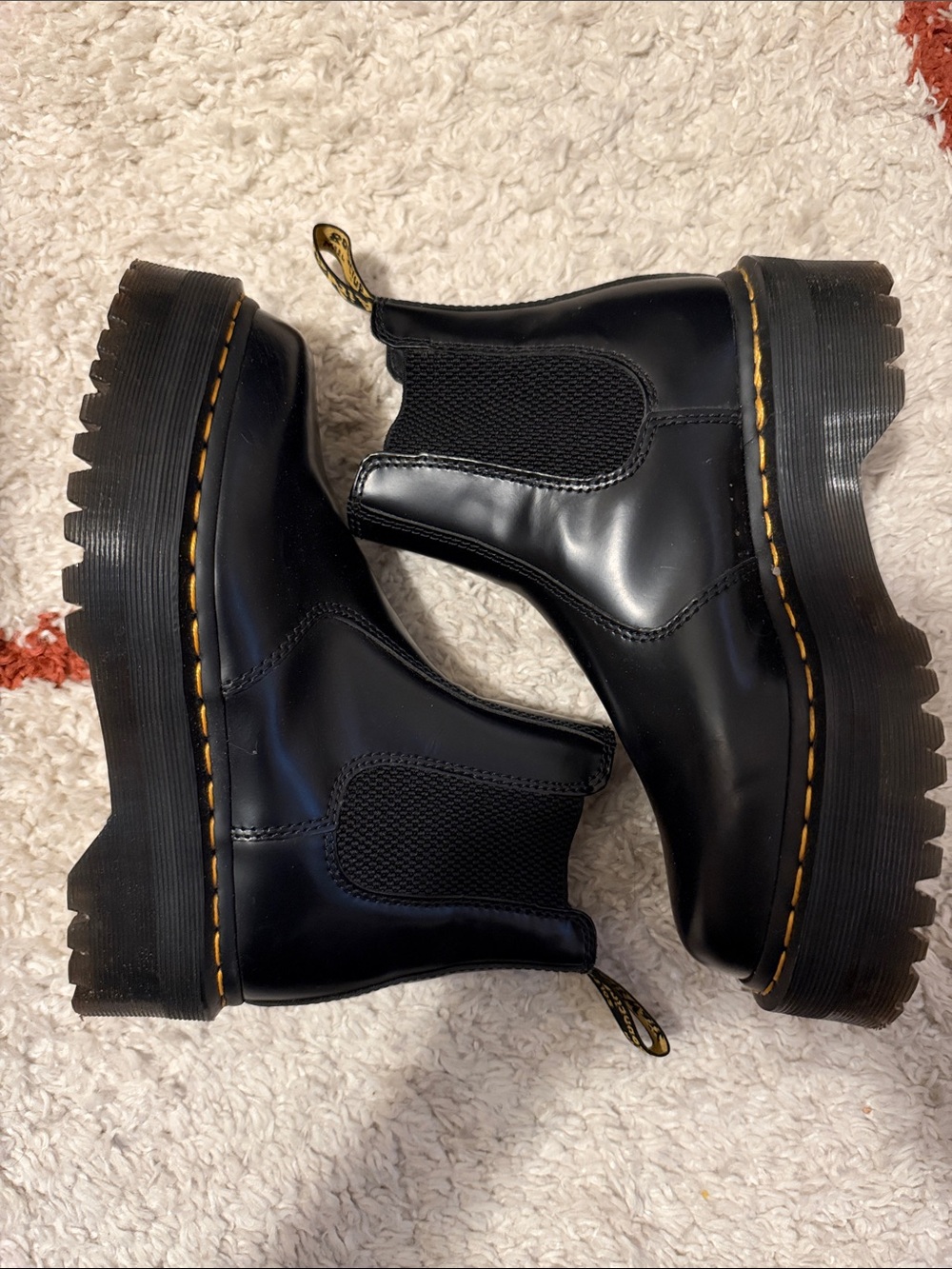 Dr. Martens Black Leather Lug Sole Chelsea Booties with Yellow Stitching
